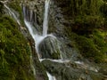 Soft waters running on rocks. Close-up of running water as a picture background Royalty Free Stock Photo