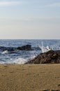 Soft wave hitting sandy beach under bright sunny day Royalty Free Stock Photo