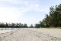 Soft wave hitting sandy beach under bright sunny day Royalty Free Stock Photo