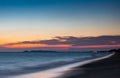 Soft wave at sea beach on blue sky and orange cloud sun set Royalty Free Stock Photo