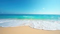 Soft waves caress pristine sandy beach, clear blue sky, day, landscape Royalty Free Stock Photo