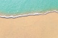 Soft waves with foam of blue ocean on the sandy beach