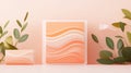 Soft waves of peach and cream on rectangular display blocks with green leaves on pale background. Royalty Free Stock Photo