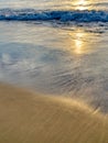 Soft waves of the sea sand close up at sunset Royalty Free Stock Photo