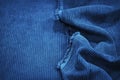 Soft wavy folds on the corduroy. Durable ribbed fabric. Close-up. Detail. Blue fabric backdrop with copy space Royalty Free Stock Photo