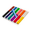 Soft wax plasticine of different colors in a box with a knife for dividing into pieces, isolated on a white background