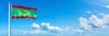 Mauritania Flag - state of Africa, flag waving on a blue sky in beautiful clouds - Horizontal banner