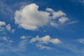 Soft white clouds in a brilliant blue sky Royalty Free Stock Photo