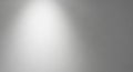 Soft White Light Beam Shining Down on a Smooth Gray Gradient Background with Subtle Texture Royalty Free Stock Photo