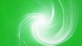 Soft white light diffusing outward in an intricate spiral pattern surrounded by a lush green background. Green screen