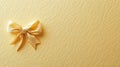 Soft yellow bow elegantly placed on textured wrapping paper, adding a festive touch to gift presentation and Royalty Free Stock Photo