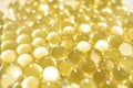 soft yellow gelatine capsules. close-up. pharmaceutical production. Royalty Free Stock Photo
