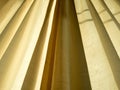 Soft yellow linen texture blinds curtains with sunlight through the windows. sun-blind Royalty Free Stock Photo