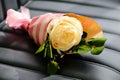 Soft yellow rose flower wrapped in paper. Beautiful handmade bouquet, selective focus