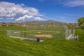 Softball or Baseball field with view of mountain and sky on a sunny day Royalty Free Stock Photo