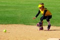 Softball Player Fielding a Ground Ball