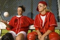 Softball Players Sitting On Bench Royalty Free Stock Photo