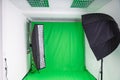 Softbox and strip light in a photostudio with green screen