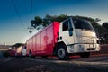 Softdrink delivery trucks leaving the warehouse