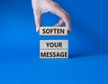 Soften your Message symbol. Concept words Soften your Message on wooden blocks. Beautiful blue background. Businessman hand.