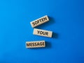 Soften your Message symbol. Concept words Soften your Message on wooden blocks. Beautiful blue background. Business concept. Copy