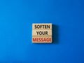 Soften your Message symbol. Concept words Soften your Message on wooden blocks. Beautiful blue background. Business concept. Copy