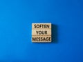 Soften your Message symbol. Concept words Soften your Message on wooden blocks. Beautiful blue background. Business concept. Copy