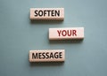 Soften your Message symbol. Concept words Soften your Message on wooden blocks. Beautiful grey green background. Business concept
