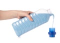 Softener conditioner in blue plastic bottle in hand isolated on white background Royalty Free Stock Photo