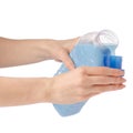 Softener conditioner in blue plastic bottle in hand isolated on white background Royalty Free Stock Photo
