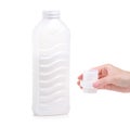 Softener conditioner in white plastic bottle in hand isolated on white background. Royalty Free Stock Photo