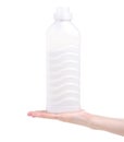 Softener conditioner in white plastic bottle in hand isolated on white background. Royalty Free Stock Photo