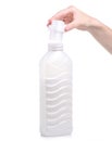 Softener conditioner in white plastic bottle in hand isolated on white background. Royalty Free Stock Photo