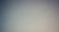 Softly blurred gradient background with subtle grain texture in muted blue gray and warm beige tones Keywords Royalty Free Stock Photo