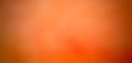 A softly blurred orange textured bokeh abstraction for the background.