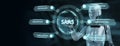 Software as a Service SaaS. Software concept. Robot pressing button on virtual screen. 3d render Royalty Free Stock Photo