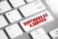 Software as a service text button on keyboard, concept background Royalty Free Stock Photo