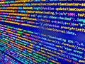 Software background technology. Software engineer at work. Coding script text on screen. Shallow depth of field, selective focus Royalty Free Stock Photo