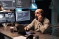 Software developer answering phone call late