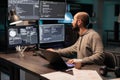 Software developer coding database on multiple monitors Royalty Free Stock Photo