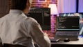 Software developer coding firewall server on computer and laptop Royalty Free Stock Photo