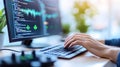 Software developer coding on modern computer with large screen displaying programming code, data visualization, digital Royalty Free Stock Photo