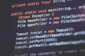 Software developer programming code. Abstract computer script code closeup on monitor screen with bokeh