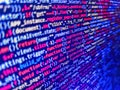 Software developer programming code. Matrix byte of binary data rian code running abstract background in dark blue digital style. Royalty Free Stock Photo