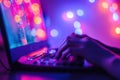 Software developer programming on laptop in colorful neon light Royalty Free Stock Photo