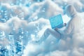 A software developer sits comfortably on a white fluffy cloud, immersed in coding on a laptop, with a breathtaking Royalty Free Stock Photo