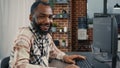 Software developer typing programming code on computer keyboard turning head and smiling Royalty Free Stock Photo