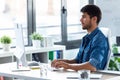 Software developer working with computer in the modern startup office Royalty Free Stock Photo