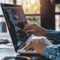 Software developer writing code on laptop working on project
