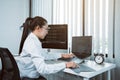 Software developers are analyzing about the code written into the program on the computer in office room